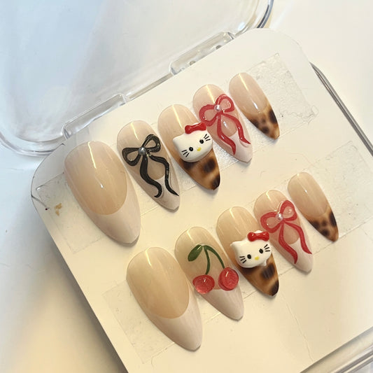 Uñas hello kitty leopardo